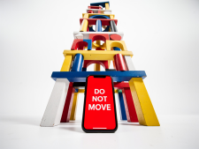 Cell phone holding up block pyramid